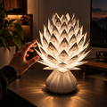 Kiro Veyra sculptural table lamp with layered white ribbed petals and cream base